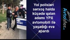 Yol polisi yolda gəzən sərxoş kişini belə apardı  - VİDEO